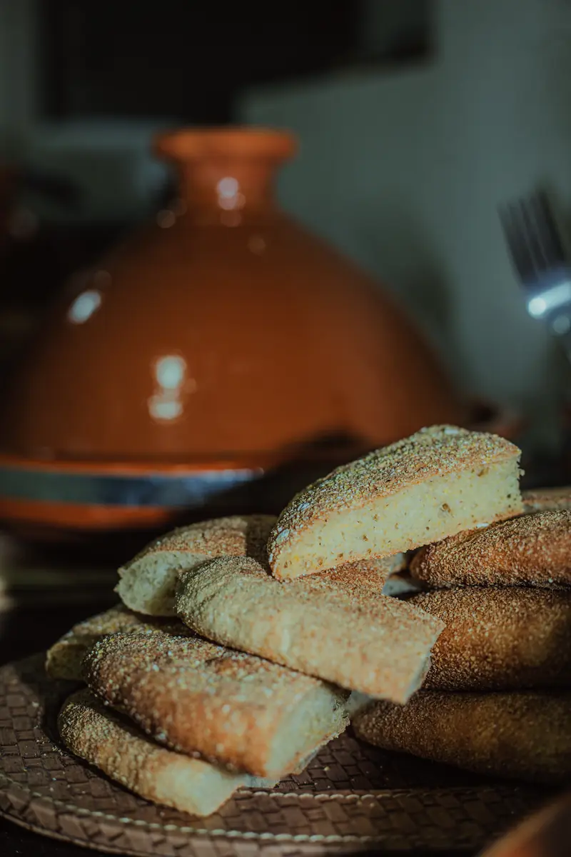 Moroccan bread and a tagine pot on the dinner table at NAVA